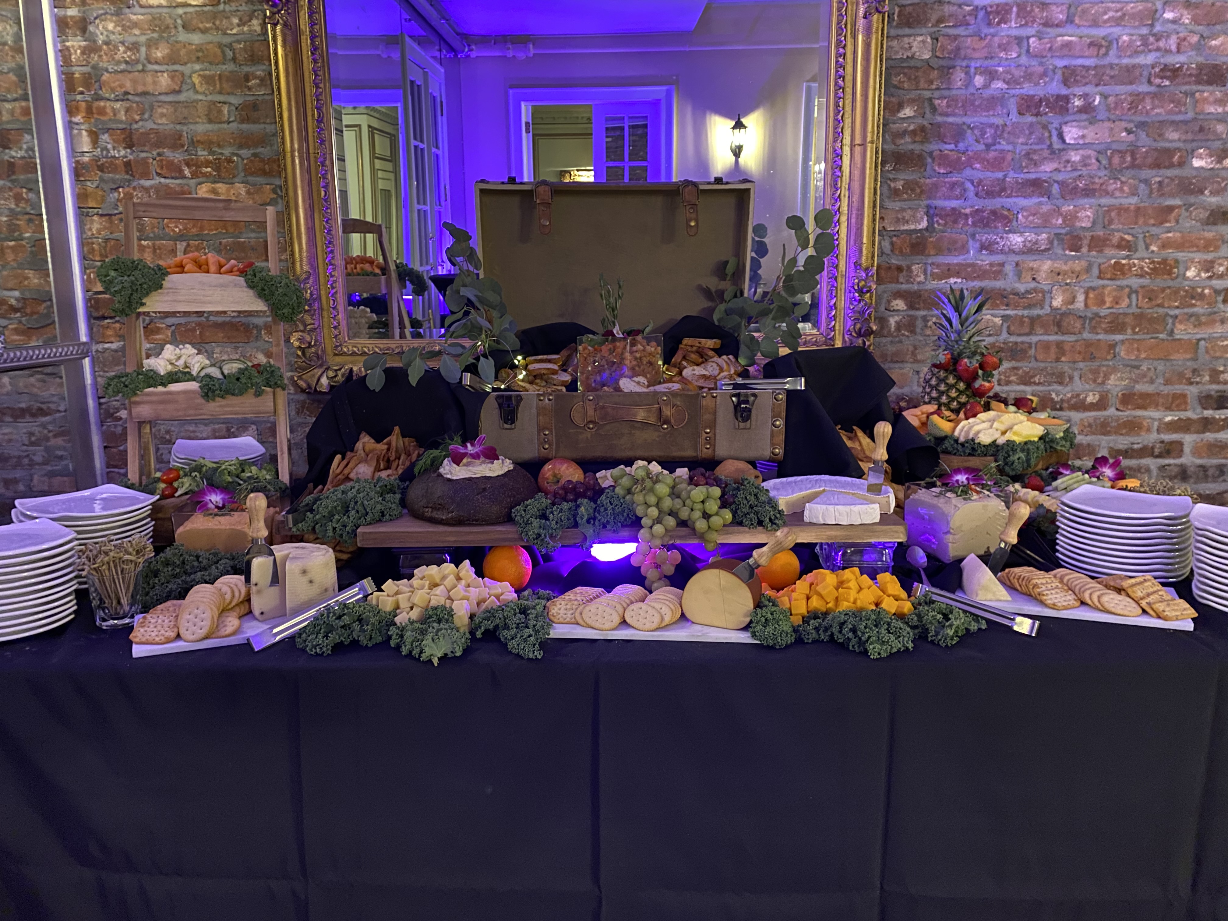 Buffet display of cheeses and fruits
